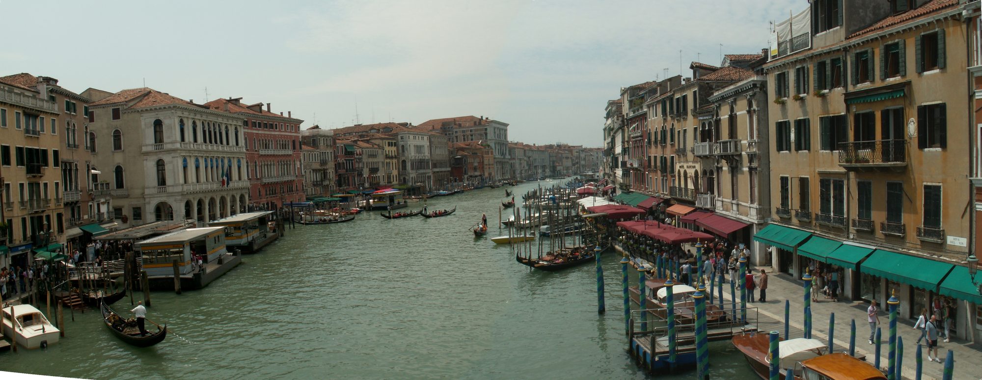 The Grand Canal looking south from the Rialto Bridge, Venice, 2006 — gondolas, vaporetto pontoons and the awnings of the Riva del Vin